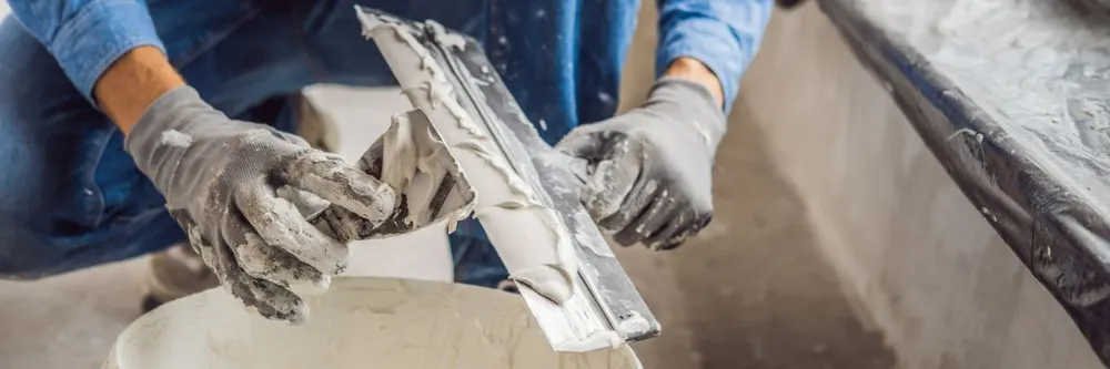 Plaster mixed and ready on a hawk